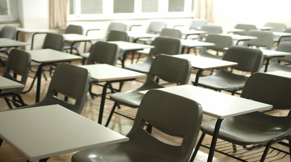 desk and chairs in a school classroom